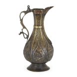 A Daghestani nielloed copper and brass ewer, Central Asia, 17th-18th century, on a splayed foot,