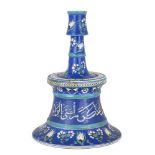 An Iznik-style pottery lampstand, Turkey, 19th century, on a splayed foot, underglaze decorated in