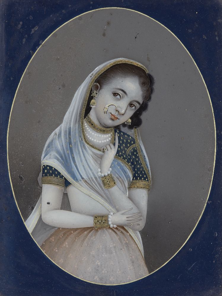 A reverse painting on glass of a young girl in Indian dress, India, early-mid 19th century, shown