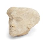 A sizeable Egyptian style limestone head of an Amarna style princess, with elongated skull with