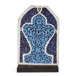 A Timurid turquoise and cobalt-blue glazed pottery niche tile, Central Asia, 14th century, with an