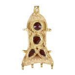A garnet and glass set gold pendant, Iran, 13th-14th century, in the shape of a fish, the raised