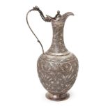 A Kashmiri silver ewer, India, 19th century, of baluster form on a spreading foot, with slender
