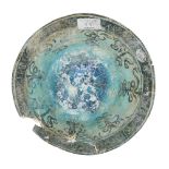 A damaged Kashan turquoise-glazed pottery bowl, Iran, 12th century, painted to the interior