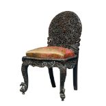 An Anglo-Indian carved wood Bombay school chair, Bombay, India, late 19th century, with rounded back
