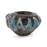 A rod-formed purple glass bulbous jar, Eastern Empire, 4th-5th century, with opaque turquoise thread