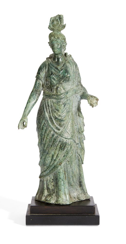 A Hellenistic bronze statue of the Isis Fortuna, 1st Century B.C., the goddess stands with her