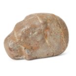 A carved stone hippopotamus, possibly Egyptian, depicted lying with his hind legs stretched