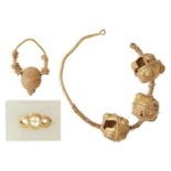 Two single earrings in the ancient style and a gold element set into a jade plaque, Iran and