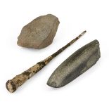 A Neolithic basalt whetstone (blade sharpener), 14.8cm; an iron nail, 26cm and a stone fragment,