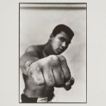 Thomas Hoepker, German b.1936- Muhammad Ali, boxing world heavyweight champion showing off his right