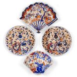 Four Japanese porcelain Imari dishes, Meiji period, two formed as fans, each decorated with birds