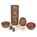 A small group of Japanese wood and ivory pieces, early 20th century, to include a carved Daruma, a