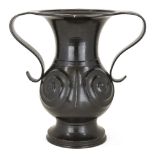 A large Japanese bronze Han style twin handled vase, 19th century, each side cast with spirals