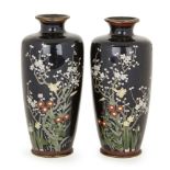 A pair of Japanese cloisonné vases, Meiji period, decorated with flowering prunus blossom amidst a