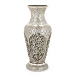 A Chinese white metal vase, late 19th century, the body with four panels pierced and repousse