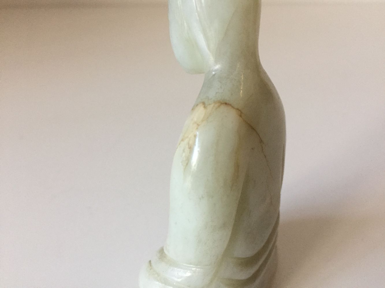 A Chinese pale green jade ‘Guanyin’ carving, 19th century, carved seated with her long robes wrapped - Image 8 of 9