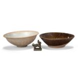 Two Chinese pottery bowls and a bronze seal, the bowls 14th-15th century, one bowl moulded with