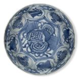 A Chinese porcelain Kraak blue and white dish, 17th century, painted to the central reserve with