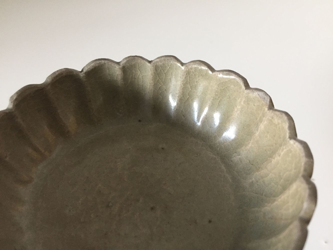 A Korean stoneware celadon 'flowerhead' small bowl, Goryeo dynasty, the exterior moulded as a band - Image 8 of 9