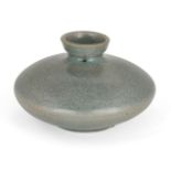 A Korean stoneware celadon oil pot, Goryeo dynasty, of flattened circular form, the exterior