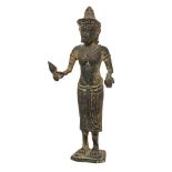 A Khmer bronze figure of Uma, 19th century, cast in the Angkor Way style, standing holding a lotus