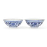 A pair of Chinese porcelain blue and white bowls, late Qing dynasty, painted to the exteriors with