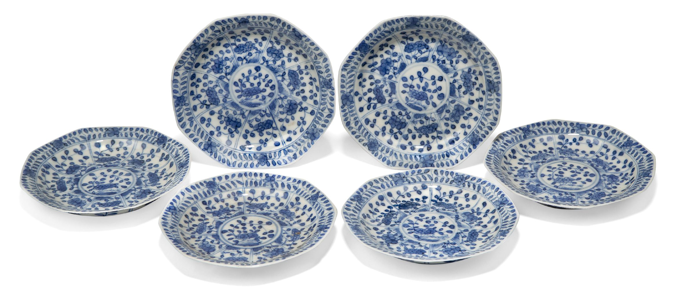 A set of six Chinese porcelain blue and white saucer dishes, 18th century, decorated with panels