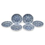 A set of six Chinese porcelain blue and white saucer dishes, 18th century, decorated with panels