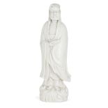 A Chinese Dehua porcelain figure of Damo, 17th century, modelled hooded with long flowing robes,