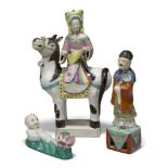 Three Chinese export porcelain famille rose figure groups, Republic period, comprising a lady on a