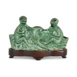 A Chinese green-enamel biscuit porcelain 'monkeys' brush rest, early 18th century, modelled as two