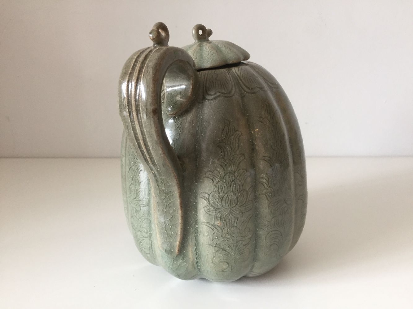 A Korean stoneware celadon melon-shaped teapot, Goryeo dynasty, the lobed body decorated with - Image 7 of 10