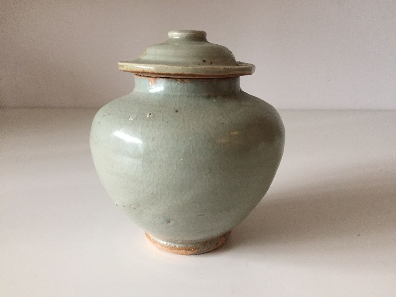 A Chinese pottery jar and cover, 15th century, covered in a greyish-green glaze, 12cm highPlease - Image 2 of 6