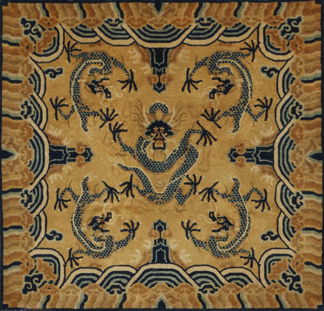 A Chinese woollen 'dragon throne' carpet, 19th century, decorated with a central confronting