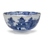 A Chinese porcelain blue and white bowl, 18th century, painted with pagodas in a continuous