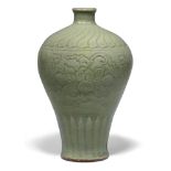A Chinese grey stoneware Ming-style celadon 'lotus' vase, 19th century, the exterior carved with two