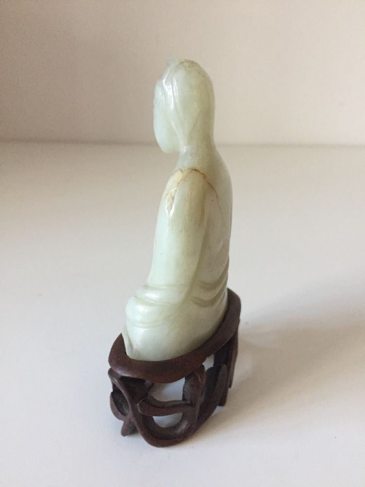A Chinese pale green jade ‘Guanyin’ carving, 19th century, carved seated with her long robes wrapped - Image 4 of 9