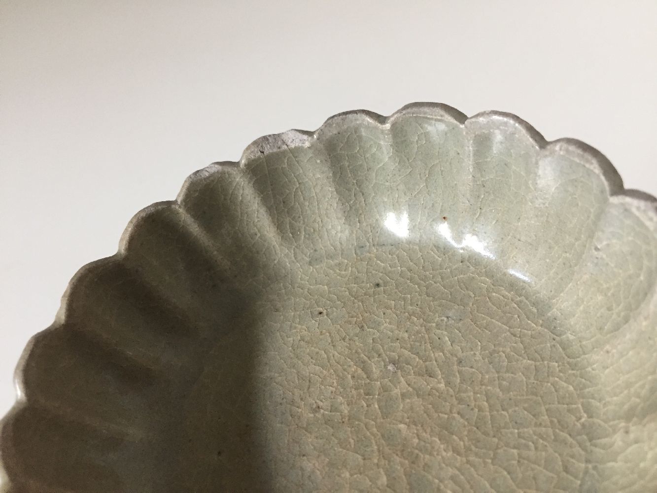 A Korean stoneware celadon 'flowerhead' small bowl, Goryeo dynasty, the exterior moulded as a band - Image 7 of 9