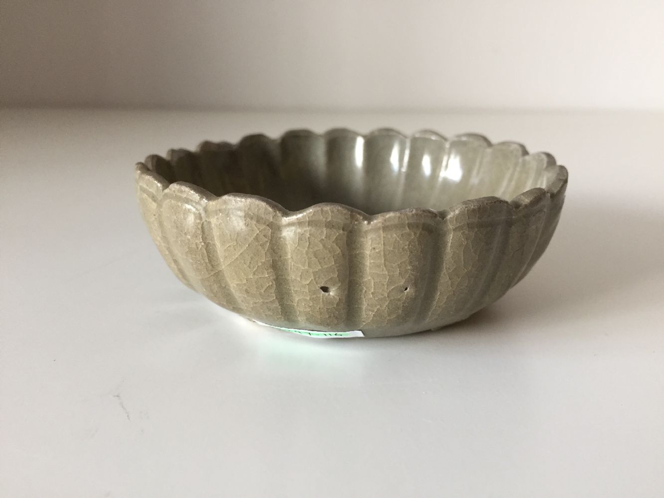 A Korean stoneware celadon 'flowerhead' small bowl, Goryeo dynasty, the exterior moulded as a band - Image 4 of 9
