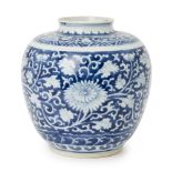 A Chinese porcelain 'chrysanthemum' jar, 18th century, painted in underglaze blue with flowering