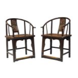 A pair of Chinese horseshoe back chairs, quanyi, early 20th century, with carved back panel