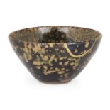 A Chinese Jizhou 'paper-cut' tea bowl, Song dynasty, with flared conical body, the interior with