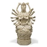 A Chinese Dehua porcelain figure of multi-armed Guanyin, 20th century, seated in dhyanasana on a