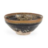 A Chinese stoneware Jian 'hare's fur' gilt-painted tea bowl, Song-Jin dynasty, the interior and