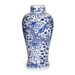 A Chinese porcelain blue and white 'dragons and peonies' baluster vase, 19th century, painted with a