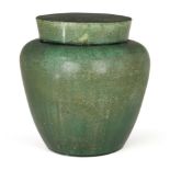 A Chinese pottery monochrome jar and cover, Ming dynasty, the exterior covered in an apple-green