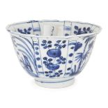 A Chinese porcelain Kraak blue and white 'birds and bamboo' bowl, 17th century, the exterior painted