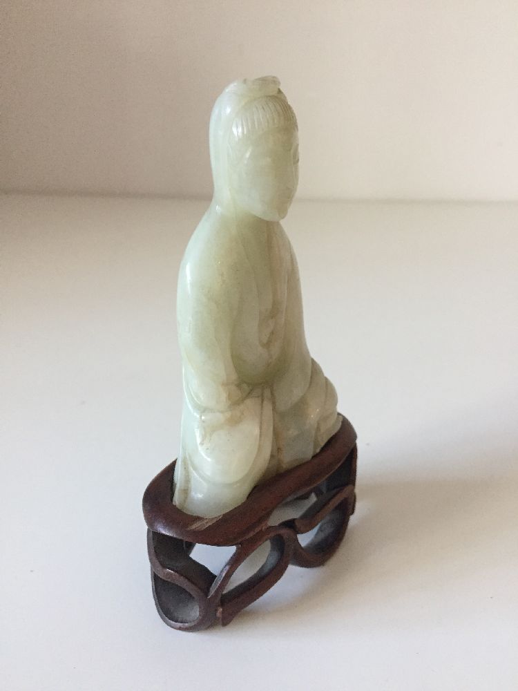 A Chinese pale green jade ‘Guanyin’ carving, 19th century, carved seated with her long robes wrapped - Image 6 of 9