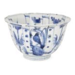 A Chinese porcelain Kraak blue and white bowl, 17th century, the exterior painted with rectangular